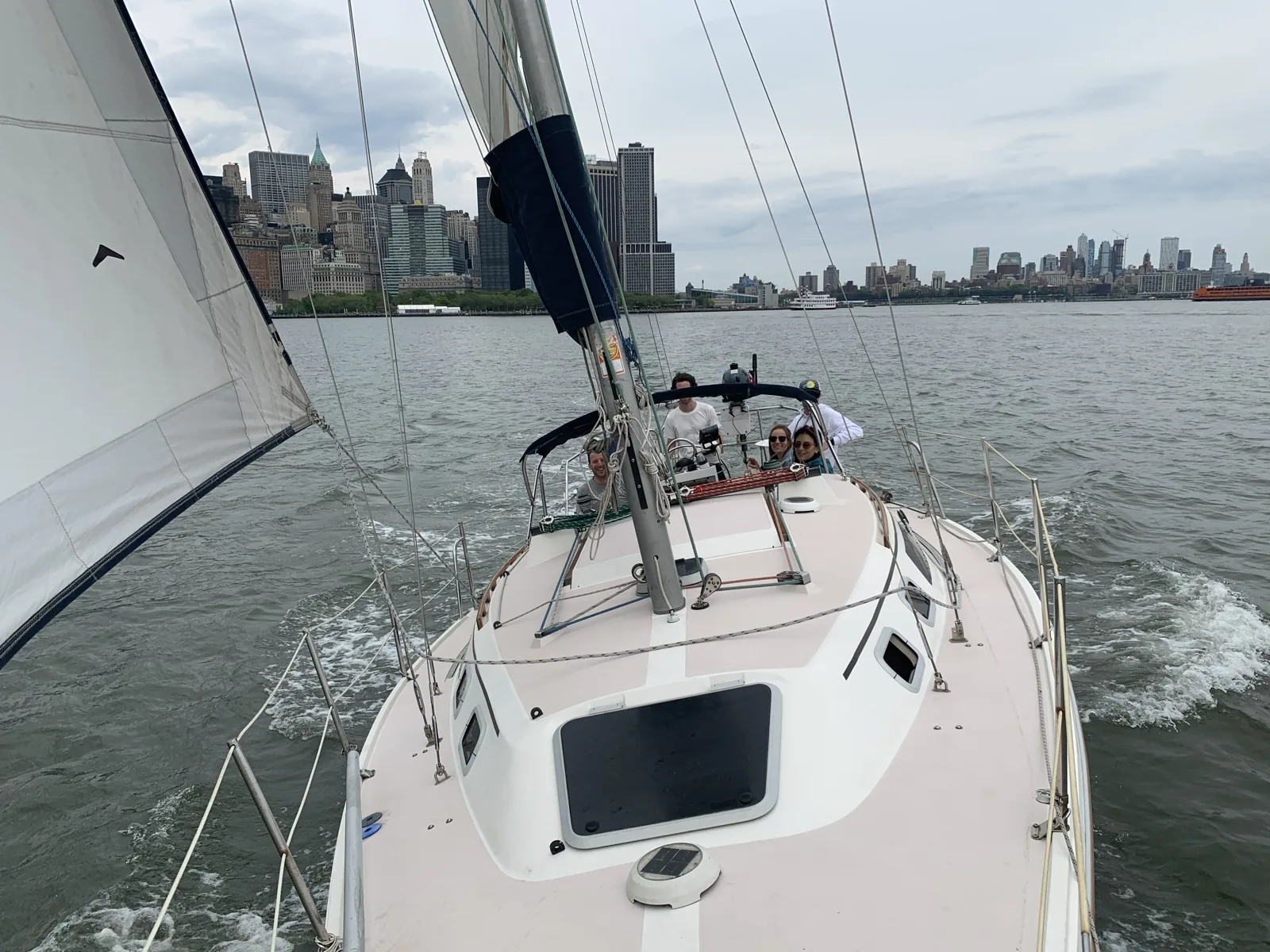 Sailing past the Lower Manhattan skyline, looking aft from the foredeck